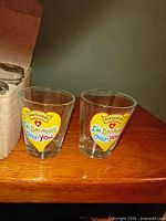 Two shot glasses showing front graphic