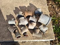 Top view of all 14 galvanized fittings showing tees, bushing and adapter