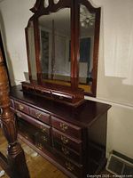 Low dresser with tri-fold mirror on top