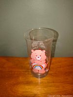 Front view of glass showing Cheer Bear graphic