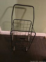 Perspective view of cart assembled showing basket and handle