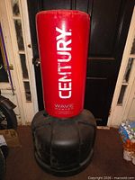 Front view of red Century heavy bag on black base