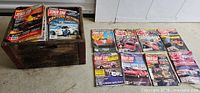 Magazines displayed in rows plus boxful showing quantity and titles