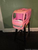 Front three-quarter view of closed pink Barbie Dream Camper