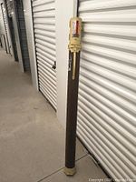 Full view of Plano Protect-A-Rod hard case standing upright