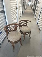 Both rattan chairs front view in storage corridor