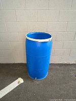 Full view of blue 55-gallon rain barrel