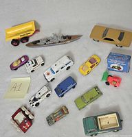 Group shot of all die cast vehicles and box on white background