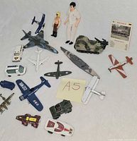 Group shot showing all vehicles, aircraft, figures and card