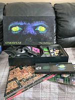 Closed game box and open tray showing all components