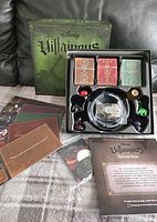 Open box showing game components: movers, cards, tokens, inserts, instructions