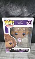 Front view of Funko Pop! Icons Whitney Houston #73 in sealed box