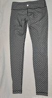 Front view of full pant showing geometric print and overall condition