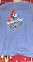 Front view of blue Hurley graphic T-shirt with tag attached
