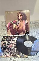 Front cover, inner sleeve photo collage and vinyl record