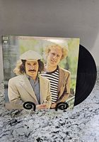 Front cover and vinyl disc of Simon & Garfunkel Greatest Hits LP