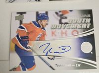 Front of Taylor Hall Youth Movement autographed card showing action image, serial number 171/249, blue signature
