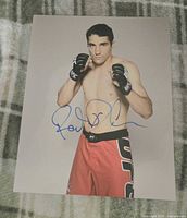 Front view of signed 8"x10" Roland Delorme UFC photo