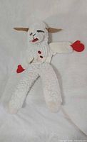Full view of Lamb Chop puppet laying flat