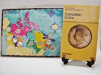 Coin set and catalogue together for scale and completeness