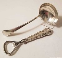 Ladle and bottle opener side by side showing overall form