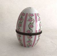 Closed porcelain egg trinket box showing exterior design