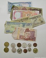 Group shot of all banknotes and coins