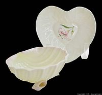 Heart-shaped dish and shell bowl together, showing forms and colour