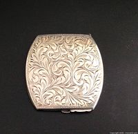 Engraved front of compact closed