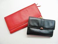 Front view of both wallets showing colors and size contrast