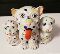 Front view of complete figural dog condiment set