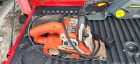 Left side view of Black & Decker Dragster belt sander showing body, cord and dust bag