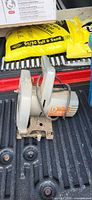 Vintage grey metal circular saw showing motor housing, handle, cord and base