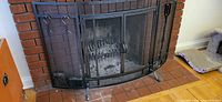 Overall view of fireplace screen in front of hearth