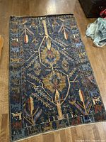Full view of Turkish rug laid flat showing overall pattern and size