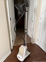 Full view of Conair upright fabric steamer standing on floor