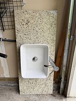Full view granite countertop with inset sink and faucet
