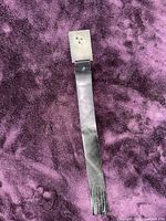 Front view showing full length leather strip and silver cap