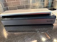 Front view of SousVide Supreme vacuum sealer closed
