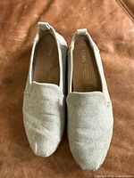 Top view of both shoes showing linen uppers and overall condition