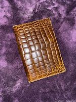 front exterior of brown alligator-embossed wallet