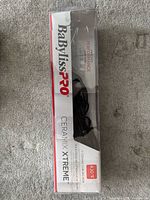 Front view of boxed BaBylissPRO CeraMix Xtreme curling iron showing branding and 430°F spec