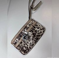 Front view of Guess leopard print wristlet