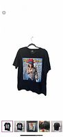 Front view of black Kid Rock Rolling Stone graphic T-shirt on hanger