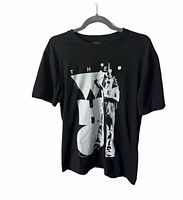 Full front view of black T-shirt with The Who graphic