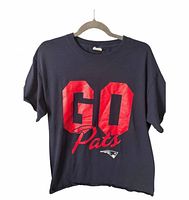 Front view of navy Patriots T-shirt on hanger