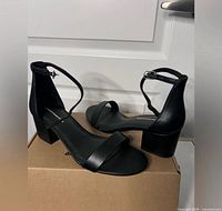 Amazon Essentials ankle-strap sandals on box