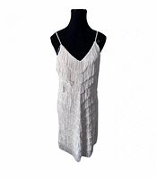 Front view of ivory fringe Syndicate dress on mannequin