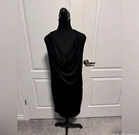 Front view of black mini dress on mannequin