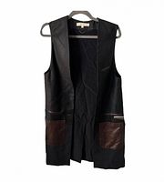 Front view of longline sleeveless vest showing open front and patch pockets